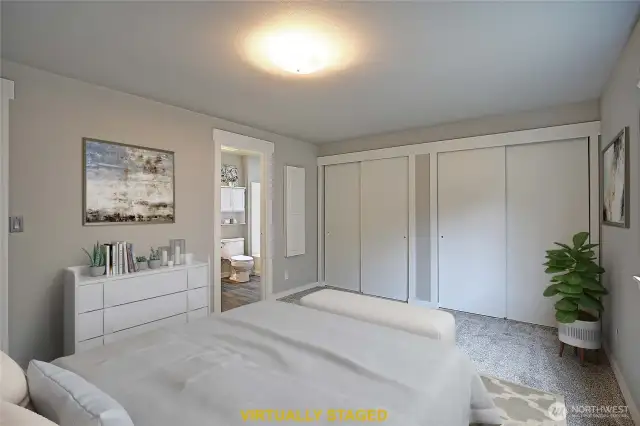 The Primary Bedroom has 2 large closets that connect behind the sliding doors.  Beautiful new paint job and carpet.