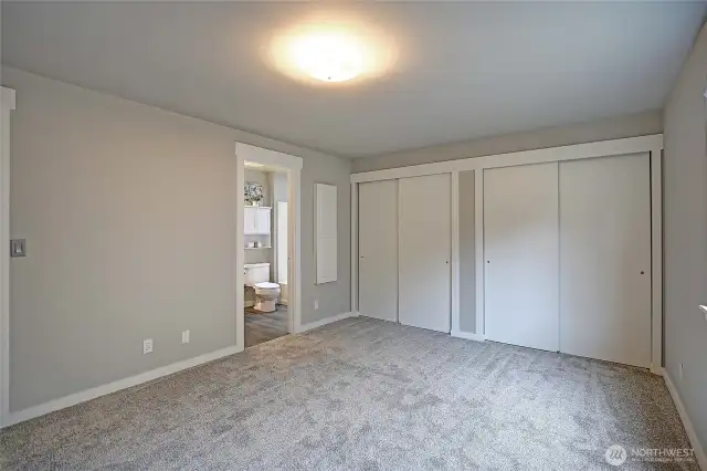 The Primary Bedroom has 2 large closets that connect behind the sliding doors.  Beautiful new paint job and carpet.