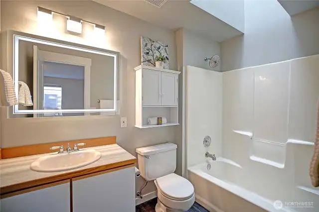 The Primary Full bath features a smart mirror with 3 lighting settings, and heat.  Automatically turns on at the main switch.  A skylight above the shower/tub offers wonderful ambient light.
