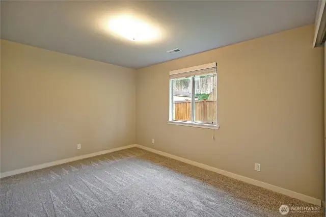 Bedroom 2 is slightly larger.  Features brand new carpet, new paint, 2" white blinds, generous sized closet.
