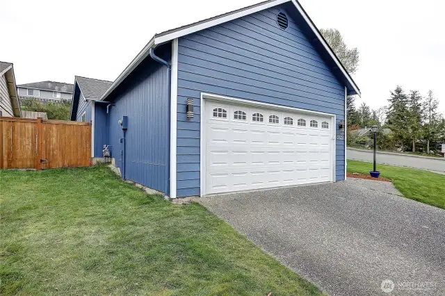 The gate to the backyard is on the North side of the home.