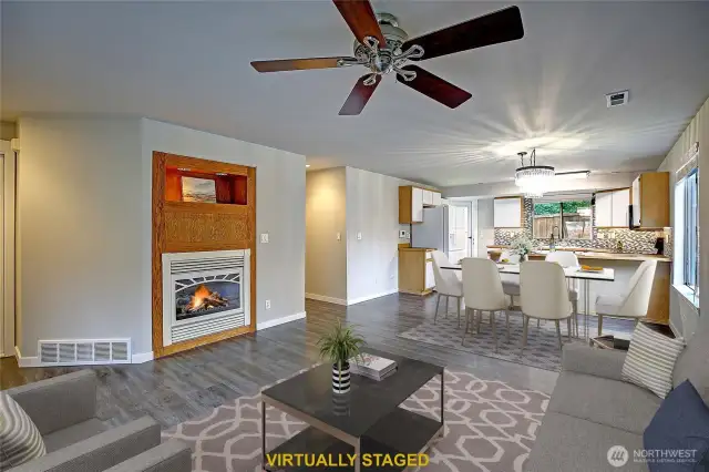 Wonderfully warm space just waiting for your personal touches.  Customized fireplace shelf with lights ready to feature your special treasures. Beautiful textured vinyl flooring throughout whole house except brand new carpeted bedrooms.
