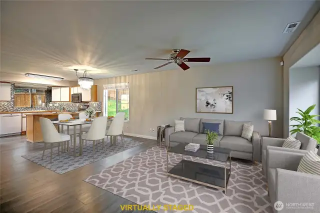 Generous main living room with nice ambient light.  Enjoy the ceiling fan to cool you on those hot summer days.