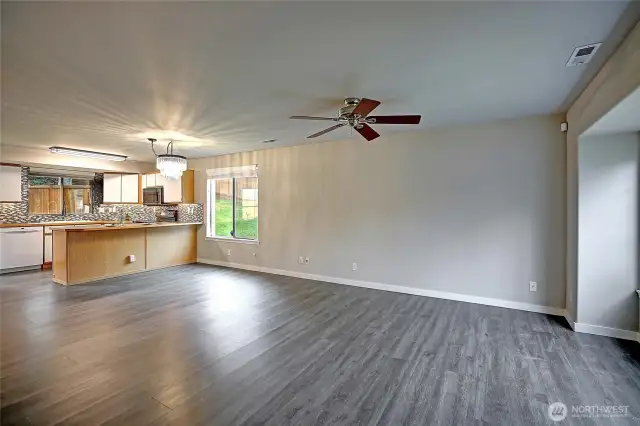 Generous main living room with nice ambient light.  Enjoy the ceiling fan to cool you on those hot summer days.