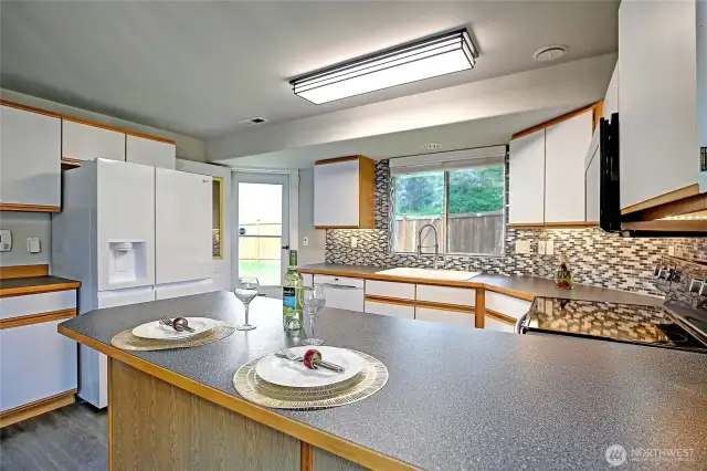 Shiny and bright kitchen just waiting for you to whip up your next meal.  Everything here is move-in ready for you!