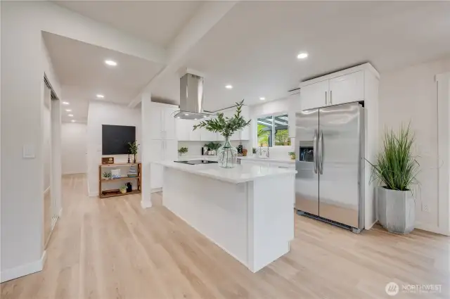 Island with range and hood, area for microwave.