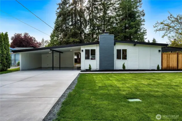 new concrete driveway that leads to side front door