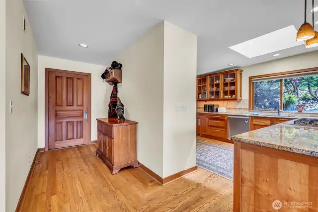 Formal entry hallway, wood flooring, opens to magnificent great room with stunning 180 degree water views.
