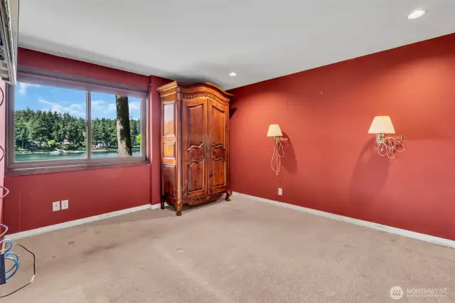 2nd Primary Bedroom with ensuite is lower level. Wall mount TV, built-in desk, sink/vanity with separate walk-in custom shower and commode.