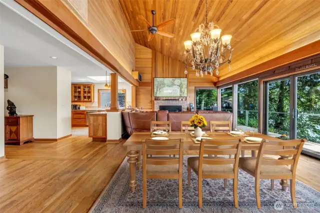 Secluded residence for 6490 Monte Vista Dr, Bainbridge Formal dining room with chandelier, tongue and groove cedar vaulted ceiling.