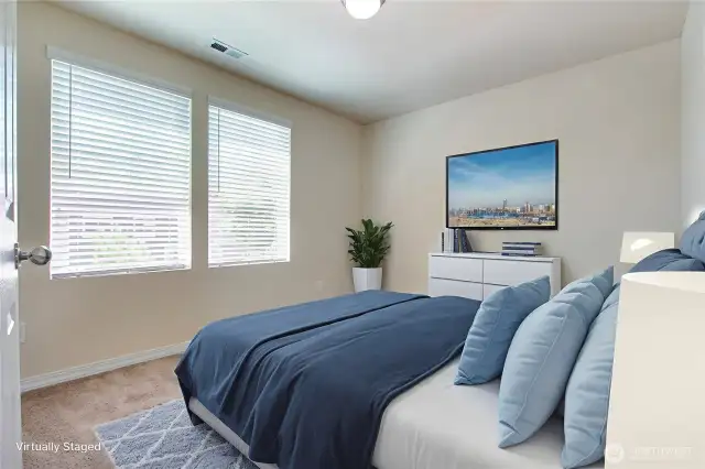 This bedroom is virtually staged to showcase its potential and is one of three generously sized bedrooms in the home. Each room offers ample space and comfort, perfect for family, guests, or a home office. The thoughtful layout ensures everyone has their own private retreat. It’s a home designed to accommodate your lifestyle with ease.