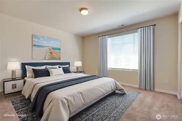 This virtually staged bedroom is spacious enough to serve as a versatile bonus area, perfect for a guest room, playroom, or home office. Its generous size gives you plenty of flexibility to make the space your own. Whether for work or play, this room adapts effortlessly to your needs. It’s a valuable addition to your new home’s layout.