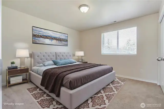 This second of three bedrooms is virtually staged, showcasing its spacious and comfortable design just like the other two. Each room offers plenty of room to personalize and relax, making them perfect for family members or guests. The generous size ensures everyone has a cozy retreat to call their own. It’s a home that balances space and comfort beautifully.