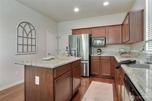The kitchen is well-appointed with all appliances included, making it move-in ready and functional from day one. Enjoy the convenience of direct access to your private garage—perfect for unloading groceries with ease. A spacious walk-in pantry adds excellent storage, keeping everything organized and within reach. This thoughtfully designed kitchen truly blends practicality with modern comfort.