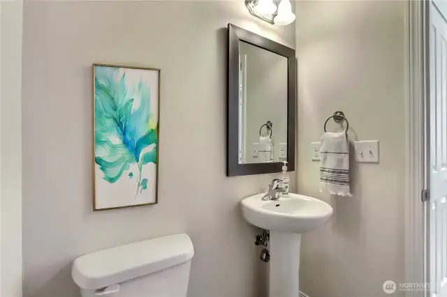 The main floor half bath is spacious and conveniently located just off the entrance, perfect for guests and everyday use. Its thoughtful placement adds both function and privacy without interrupting the flow of the home. With modern finishes and plenty of room to move, it offers comfort and style in a practical design. It’s a small detail that makes a big difference.