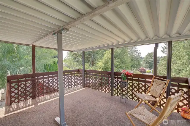 Upper level covered deck opens up just off the living/dining room.