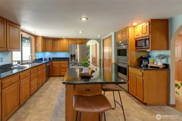 Gourmet Kitchen Includes Premium Stainless Steel Appliances...Center Island Cook Top, Double Convection Oven & Warming Drawer, Refrigerator w/Ice-Maker, & Dishwasher...