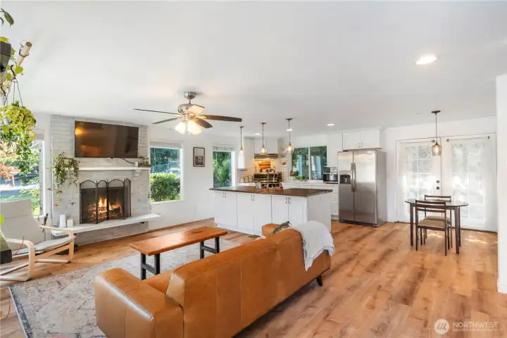 Enter to beautifully updated home featuring luxury vinyl plank floors, clean and bright kitchen with center island, eating area, built ins and cozy fireplace.  Newer windows throughout most of the house