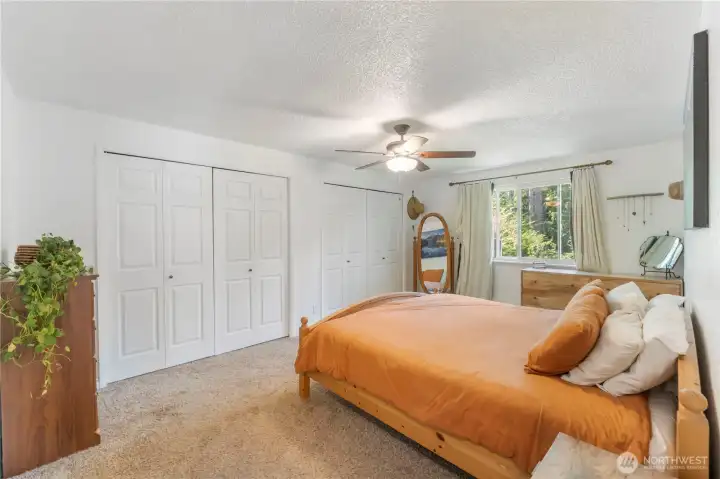 Upstairs primary suite with 2 large closets and attached continental bath
