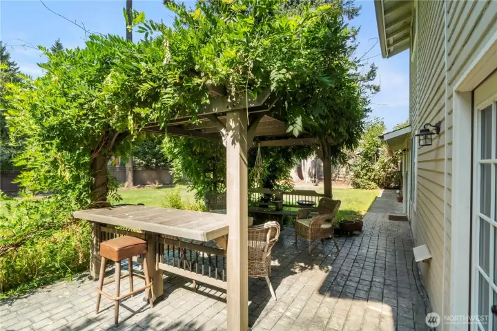 Cobblestone patio with pergula is a perfect place to relax