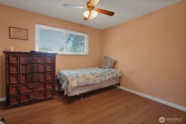 Primary Bedroom with laminate flooring.