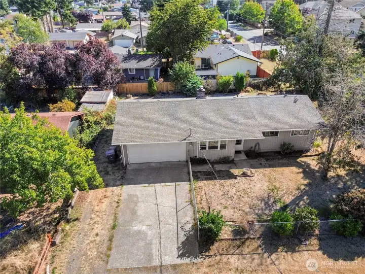 Drone shot of the home. Huge yard! Fully fenced front and back!