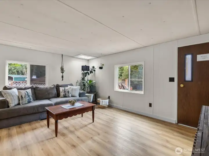 Spacious living room with access to rear deck.
