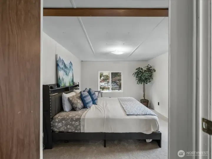 Large primary has plenty of room for a king bed.