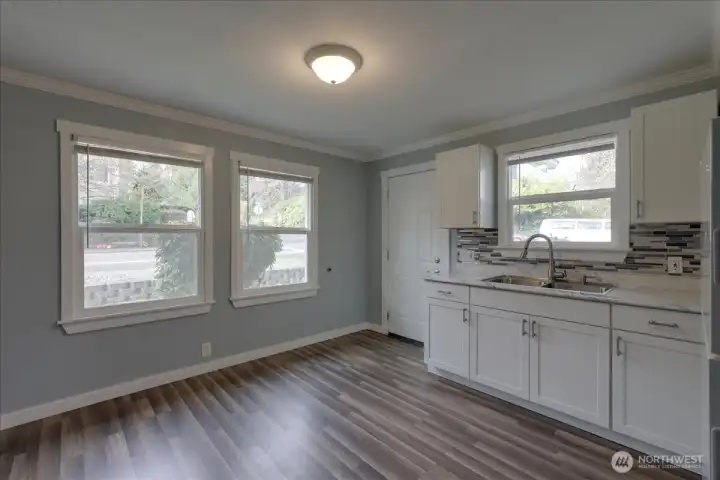 Unit #2 Kitchen shot looking out to Hardie Ave. Newer blinds throughout all units.