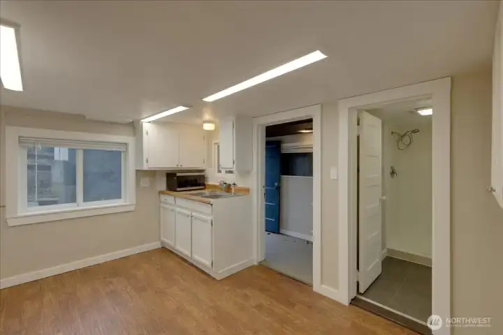 Unit #5 Kitchen shot showing, entrance with storage. Bath is on right. New blinds replaced in all units.