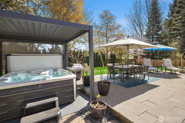 Gorgeous, wraparound patio with a large hot tub