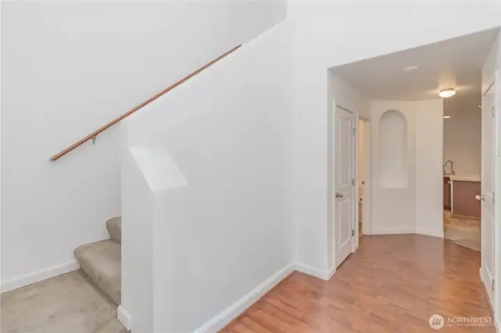 Sweeping entry way brings in tons of light and character