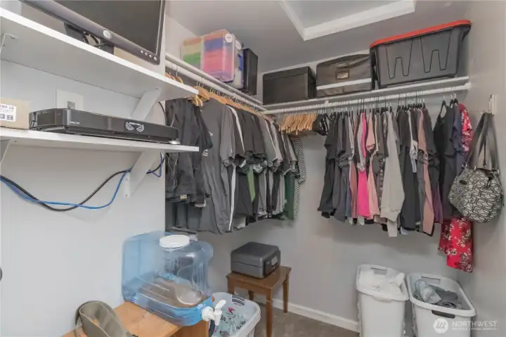 Primary walk-in closet, security system stays with home