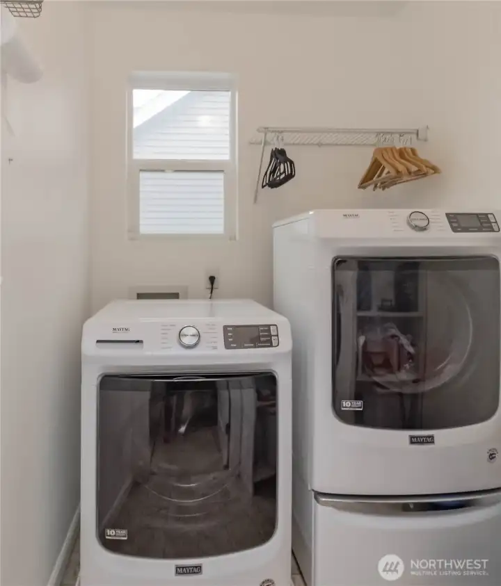 Front loading washer and dryer on second floor near bedrooms, all stay with home