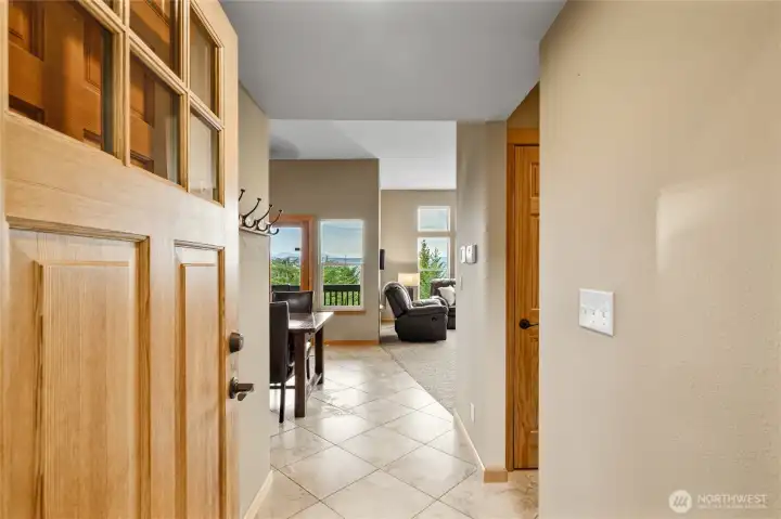 Come on in! The light-filled main level is warm and welcoming, with expansive windows that showcase the surrounding mountain views.