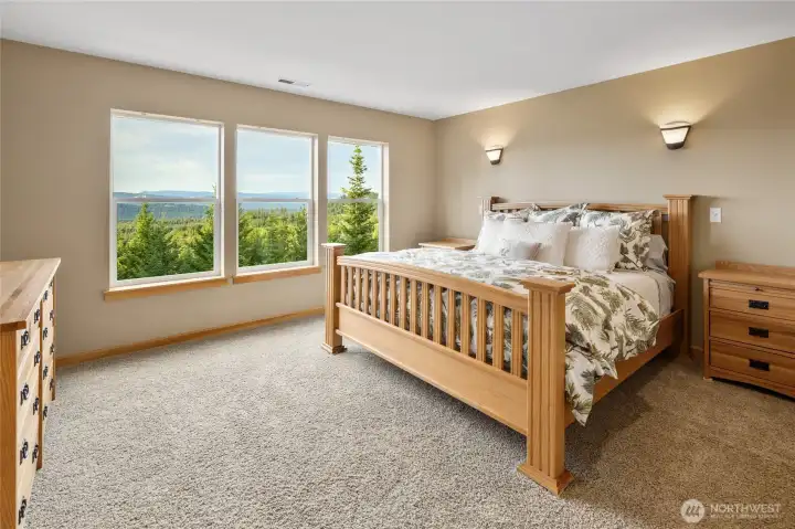 Welcome to the upper-level primary suite, a warm and inviting retreat with sweeping mountain views and a private ensuite bath. Two additional bedrooms are conveniently located on this level.