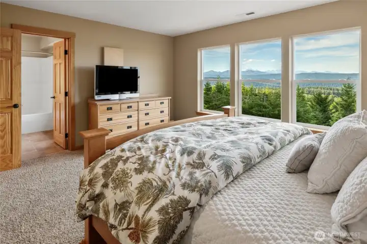 The views from the primary suite are exceptional, offering a front-row seat to the changing seasons and surrounding mountains.