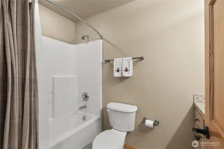 Another view of the well-appointed full hall bath.