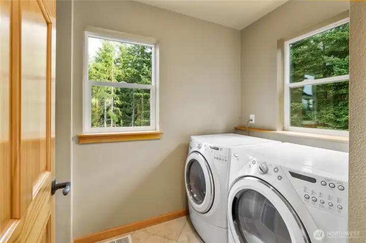 Even the laundry room benefits from generous windows and abundant natural light! Generously sized and plenty of storage space not pictured here.