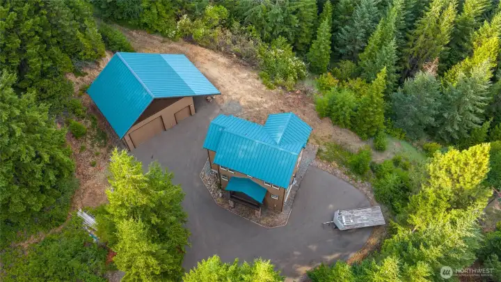 With a low-maintenance metal roof and abundant parking for vehicles, trailers, and mountain toys, this property is ready for every adventure.