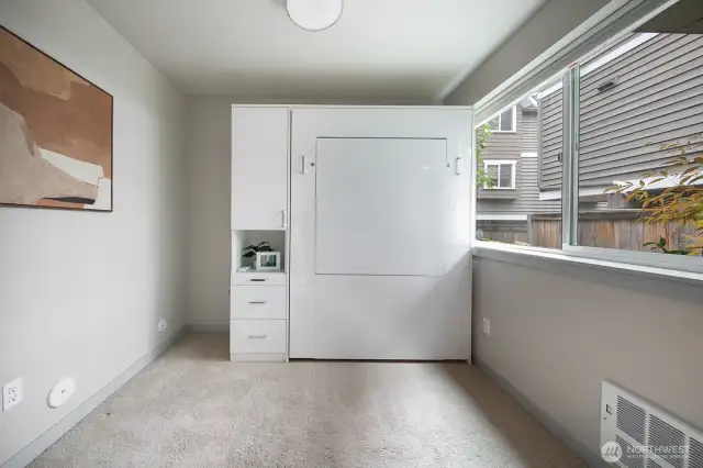 Versatile guest bedroom featuring a built-in Murphy bed and storage—perfect as a home office or guest space.