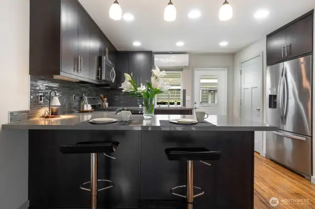 Kitchen features a pantry for ample storage and direct access to the private patio