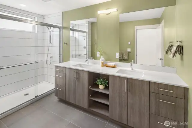 Spacious primary bathroom w private lavatory.