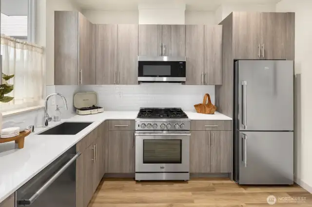 Quartz counters and Beko appliance package.