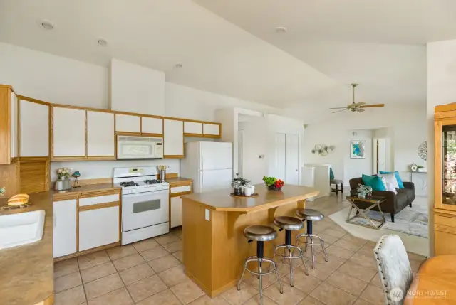 Spacious Kitchen with vaulted ceilings, ample storage, center island and gorgeous lake views