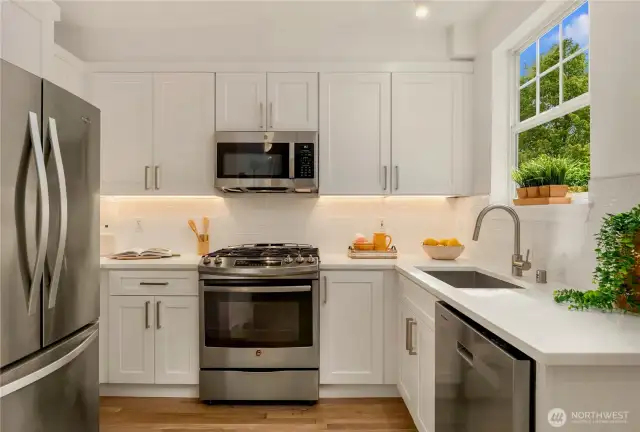 New cabinets, quartz countertops, undercabinet lighting and new sink (D/W & Microwave too).