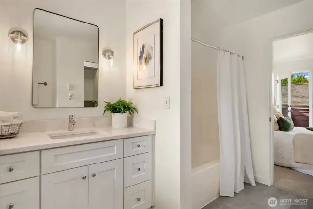 Primary bath with new flooring & vanity.
