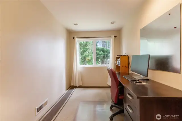 Tucked away on the upper level, this versatile space works beautifully as a home office or imagine a comfy chair, soft lighting, and baskets for your favorite books. Whether you’re reading, journaling, or simply enjoying a moment of stillness, this cozy retreat offers a peaceful spot to unwind and recharge.