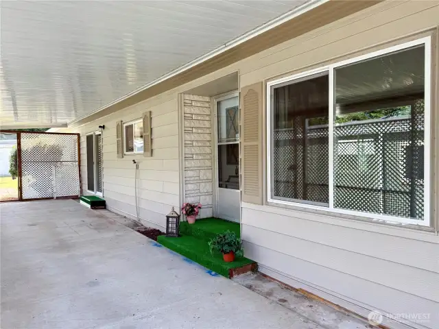 Covered front patio, large enough for entertaining.