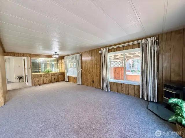 More of the living room, with the a view of the dining area.